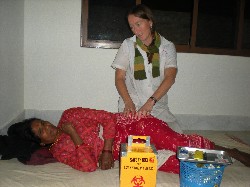 Diane treating a Newari woman