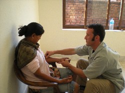 Garret treating a Nepali woman