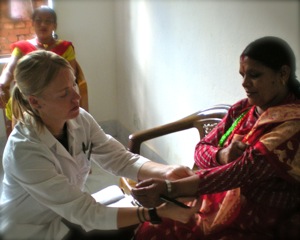 Nikole treting in Nepal Clinic